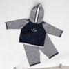 Check out one of our new arrivals! Your little one will be cuter than cute in this striped hoodie/pant set! Lightweight and versatile fabric and featuring a convenient zipper back. Front of hoodie is also great for adding personalized text and/or images! 100% Cotton by a soft idea